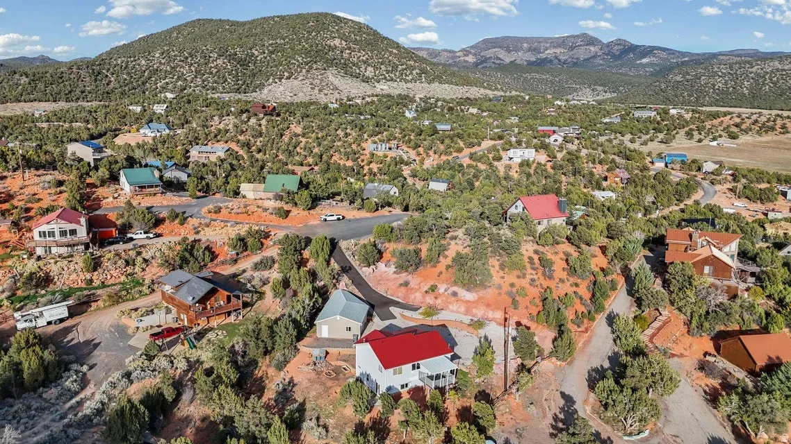 Aerial overview of property's location with a mountainous background