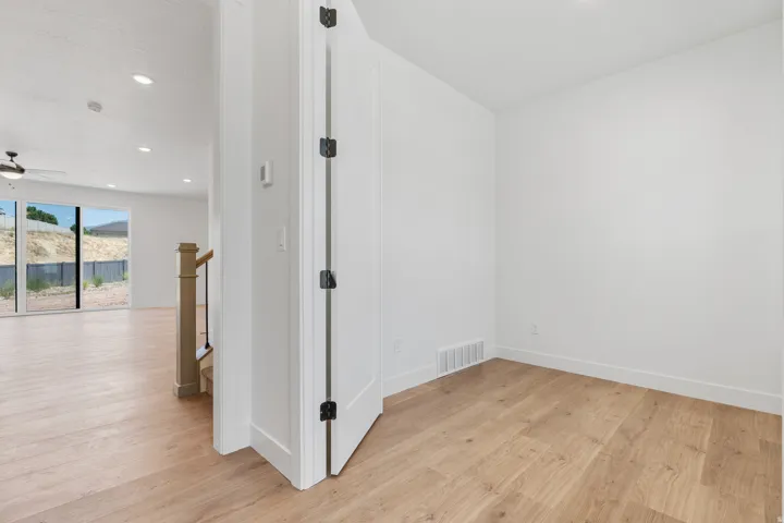 Unfurnished room featuring light wood finished floors, recessed lighting, and ceiling fan