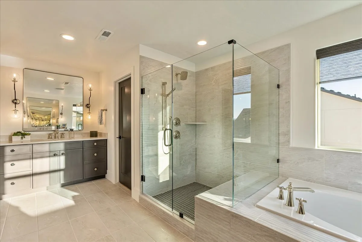 Primary Bathroom featuring vanity, a bath, light tile patterned flooring, a shower stall, and recessed lighting