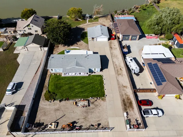 Aerial view of residential area featuring a large body of water
