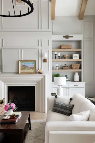 Living room with a fireplace and beam ceiling