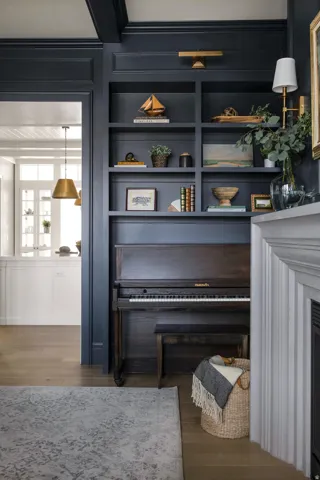 Detailed view of wood finished floors, a fireplace, and built in features