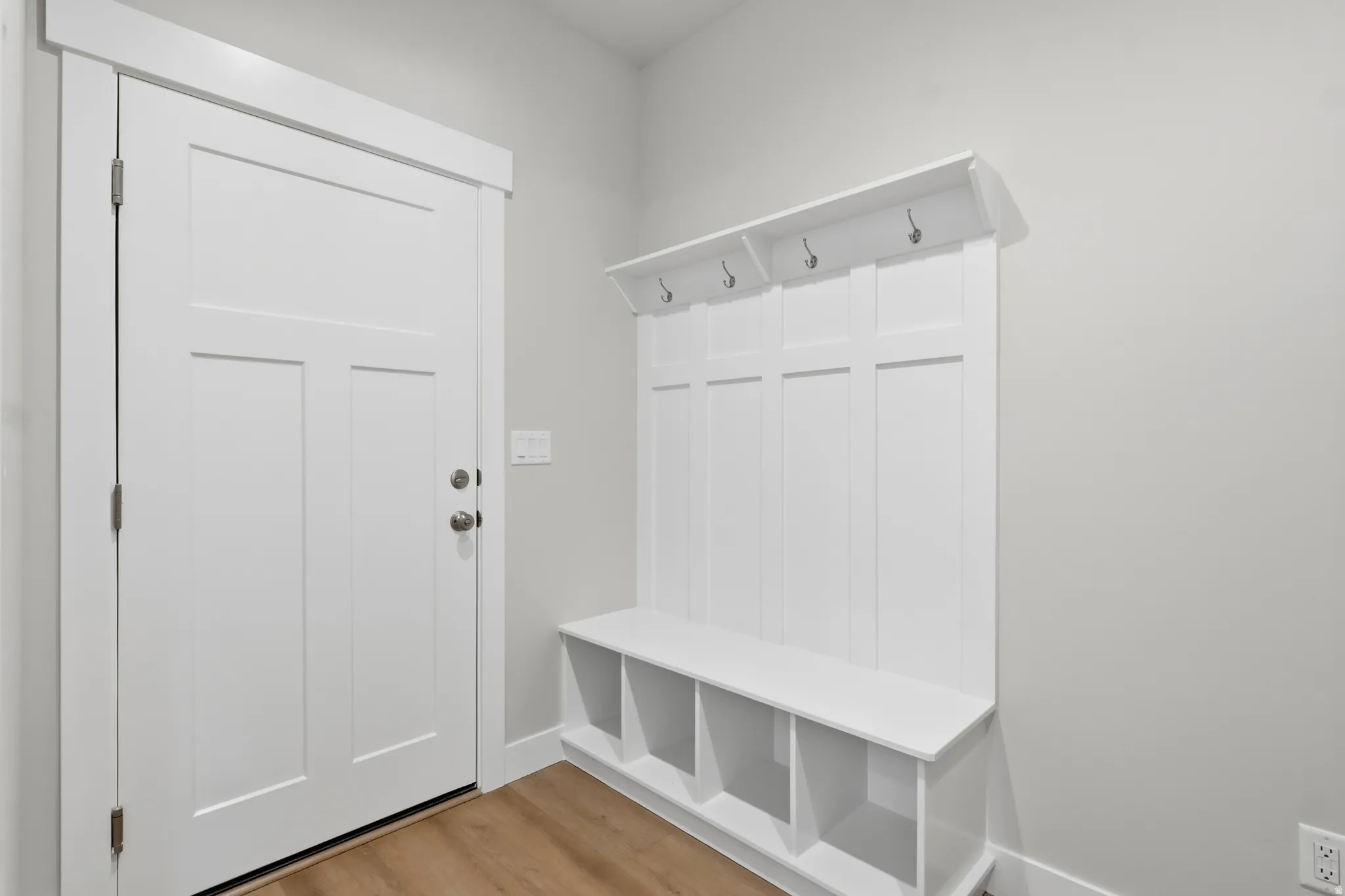 Mudroom with light wood-style floors