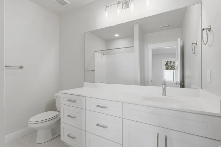 Bathroom with vanity and a shower