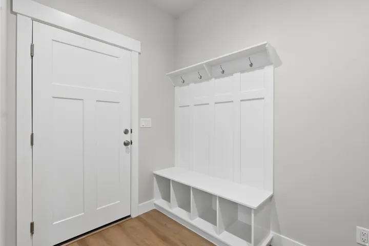 Mudroom with light wood-style floors