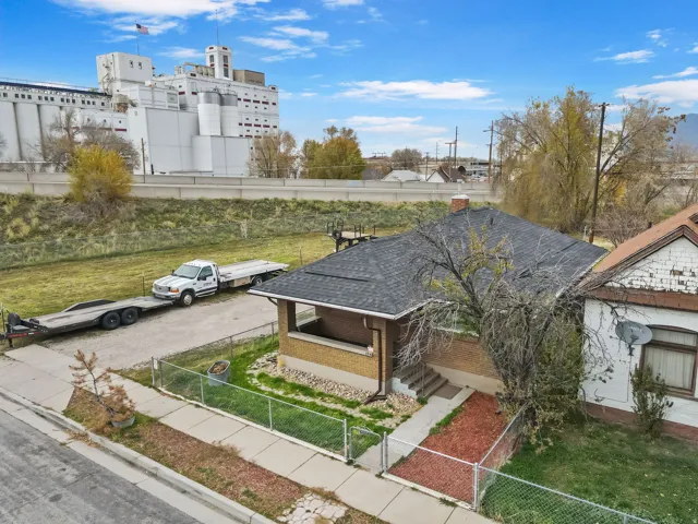 View of community featuring a gate, a fenced front yard, and a porch