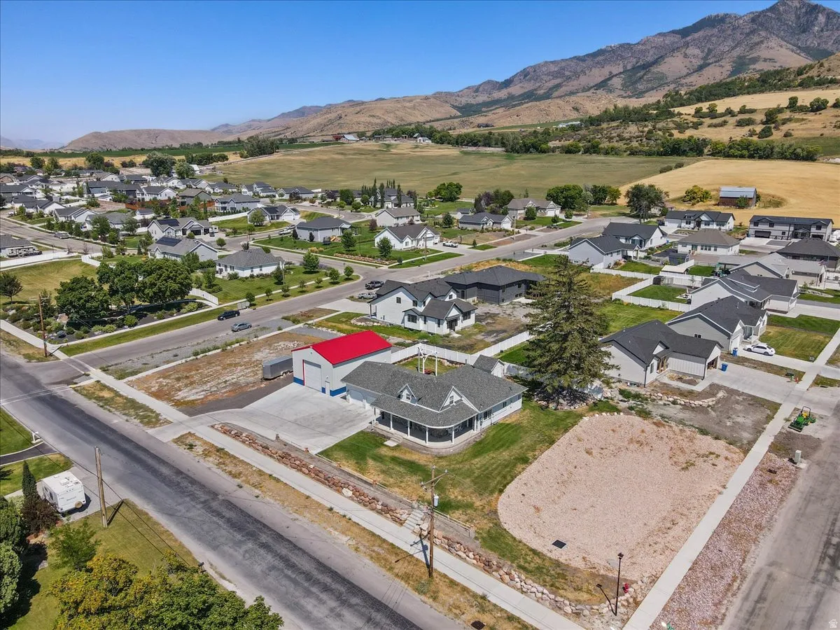 Aerial view of residential area featuring a mountain backdrop