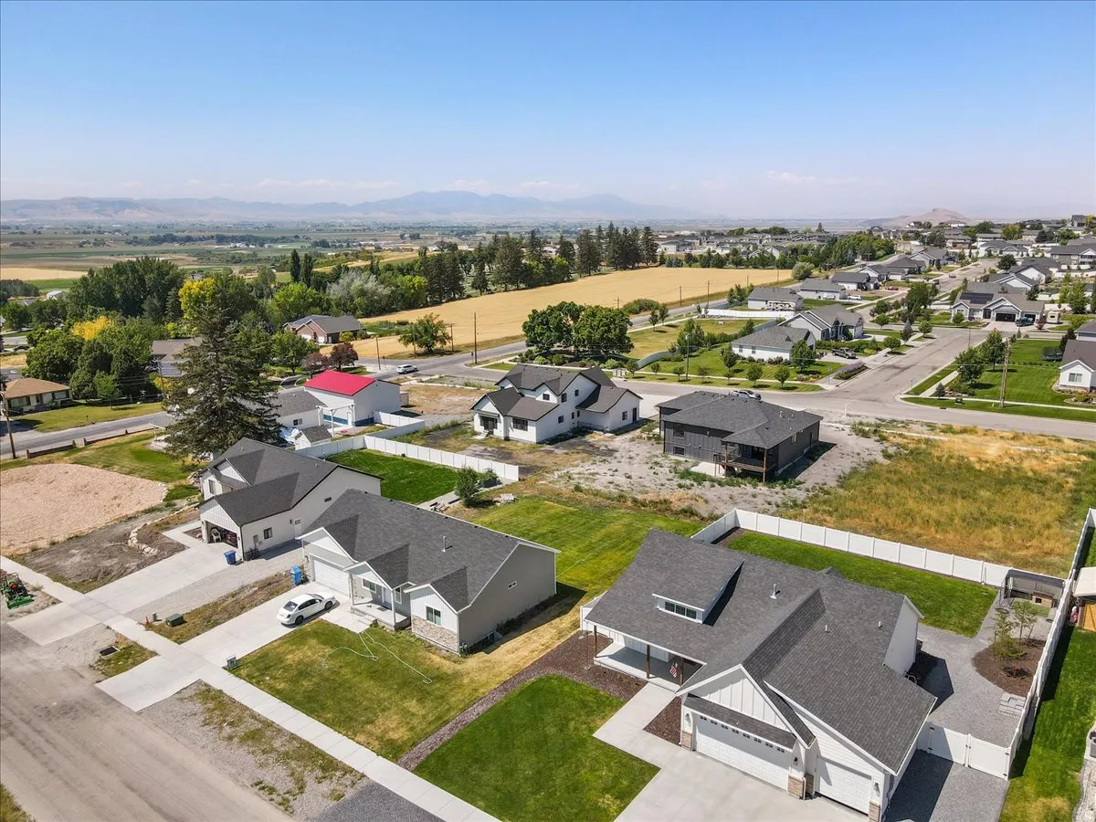 Aerial view of residential area with a mountainous background