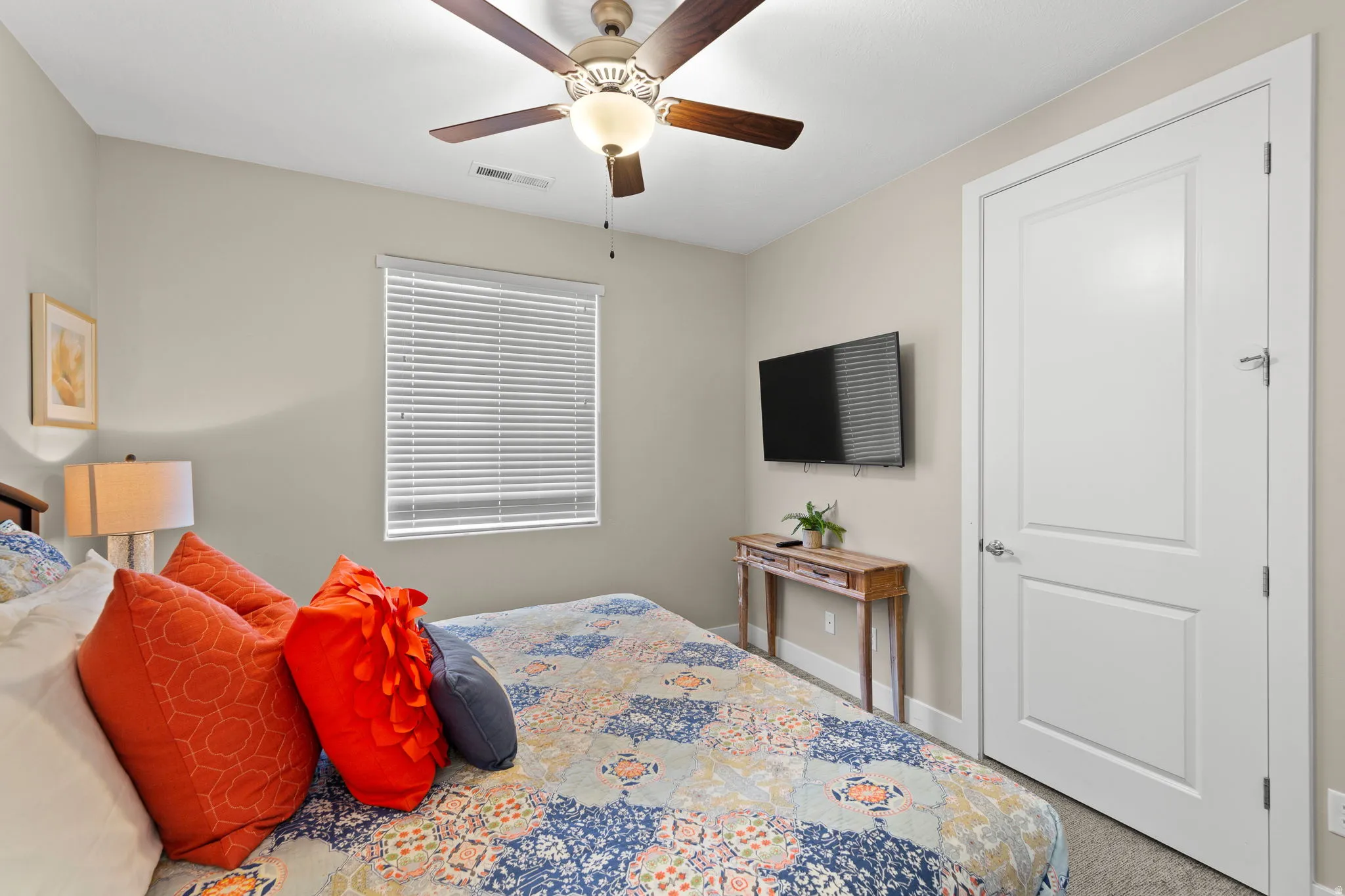 Bedroom with carpet and a ceiling fan