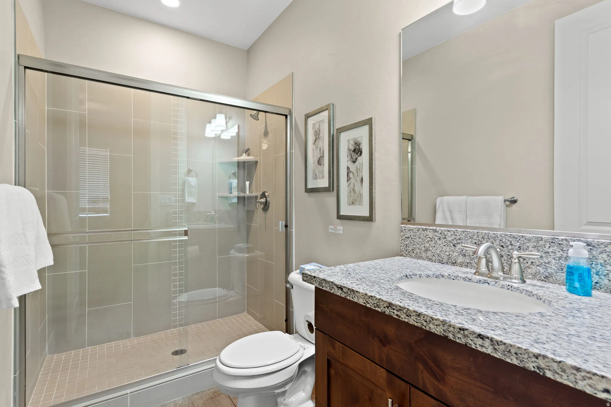Bathroom with vanity and a shower stall