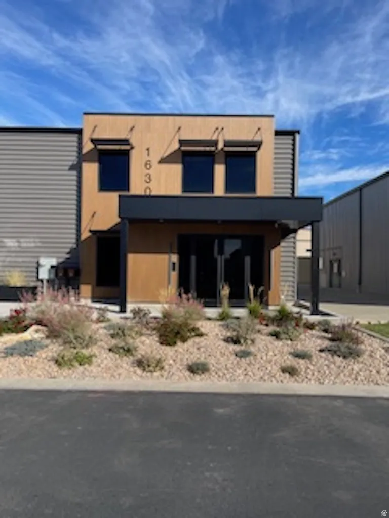 Contemporary home featuring stucco siding