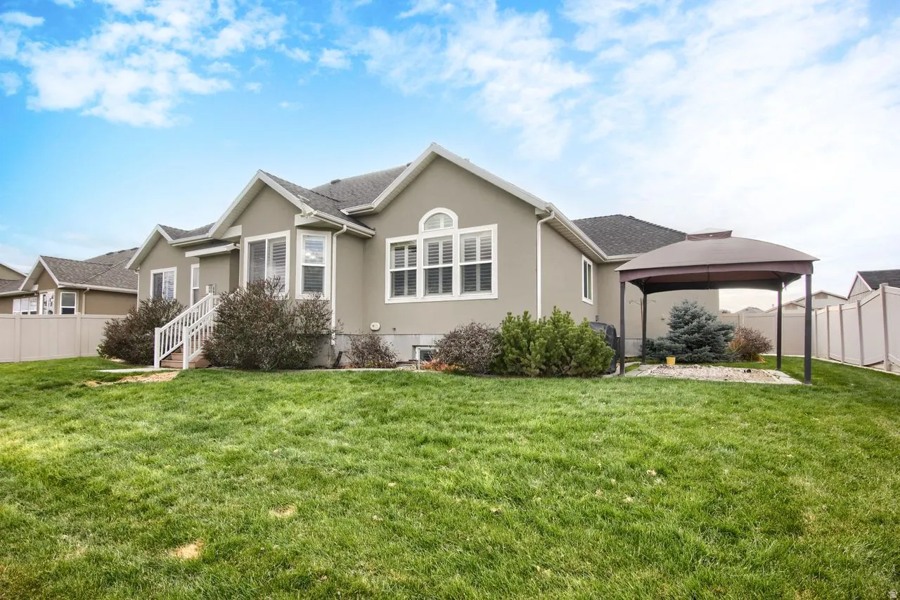 View of north side of home featuring stucco siding