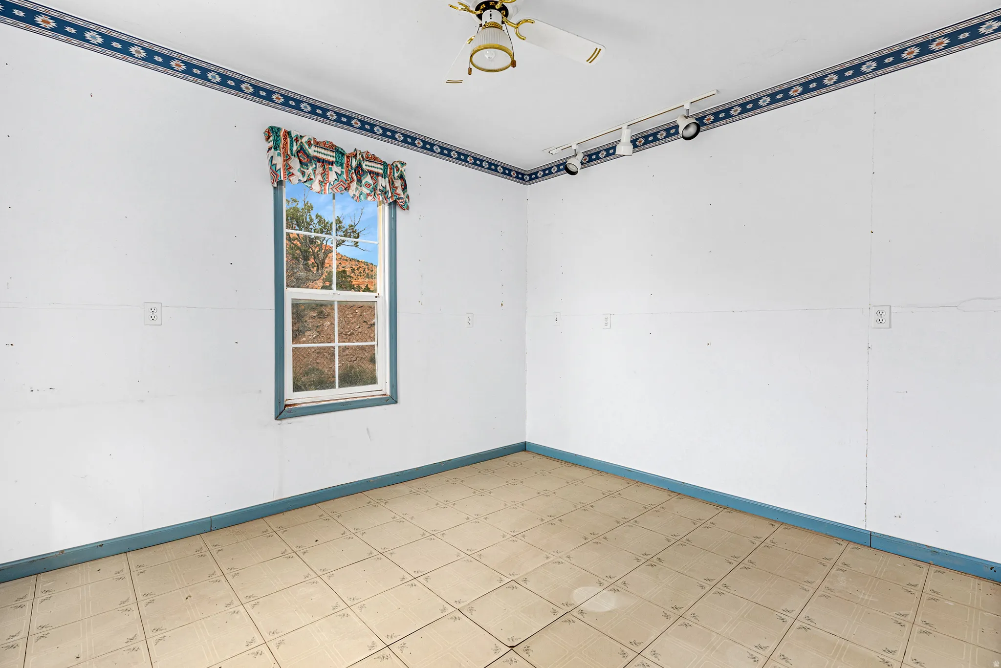 Spare room with tile patterned floors