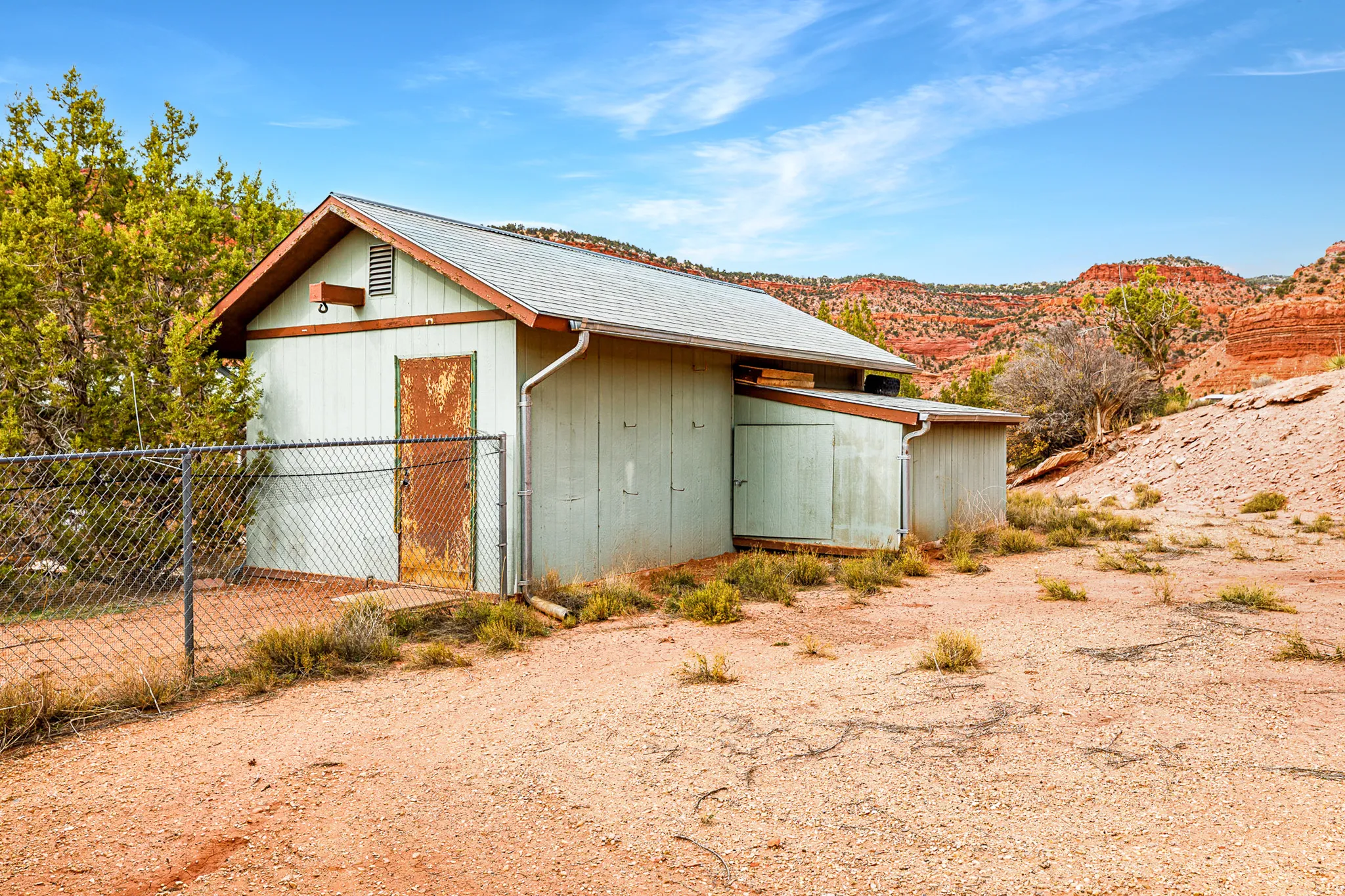 View of home's exterior with an outdoor structure