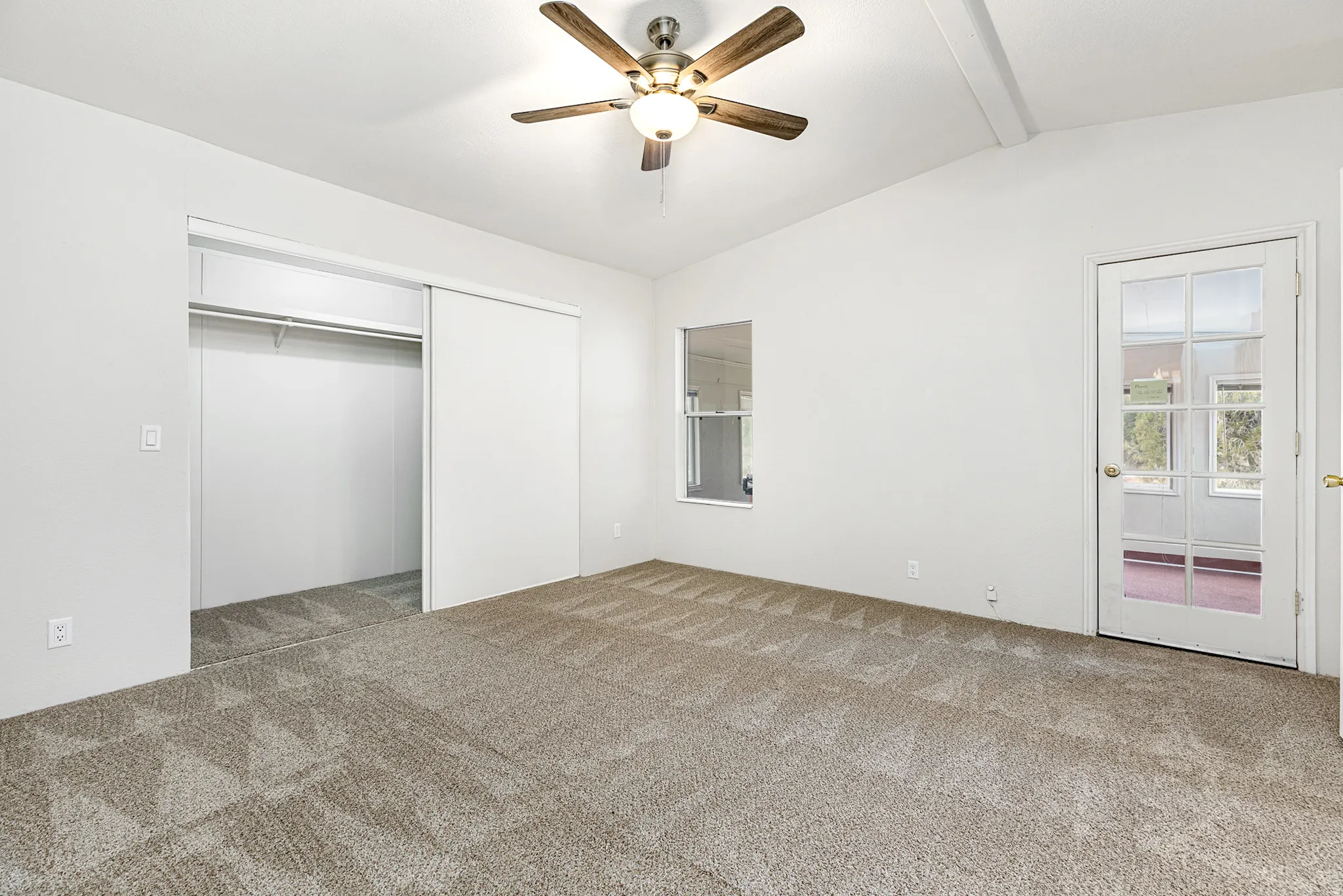 Unfurnished bedroom with carpet flooring, a ceiling fan, and a closet