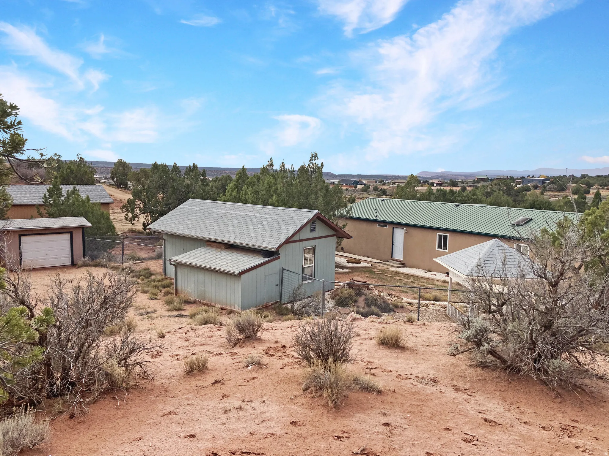View of home's exterior with an outbuilding