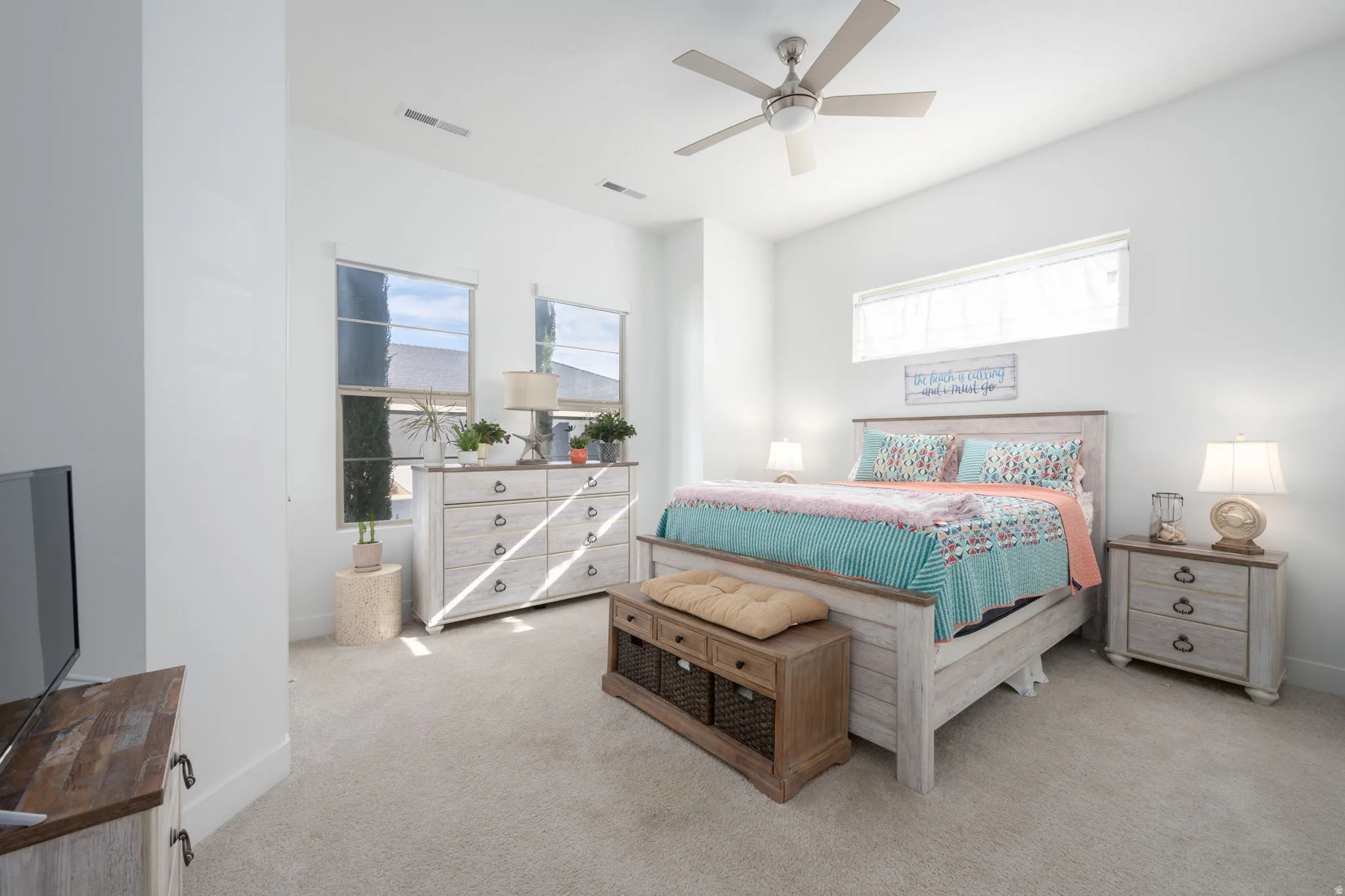 Bedroom featuring light carpet and ceiling fan