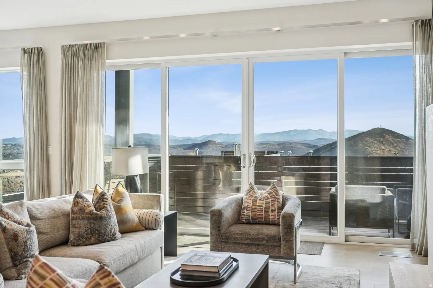 Sunroom with a mountain view and healthy amount of natural light