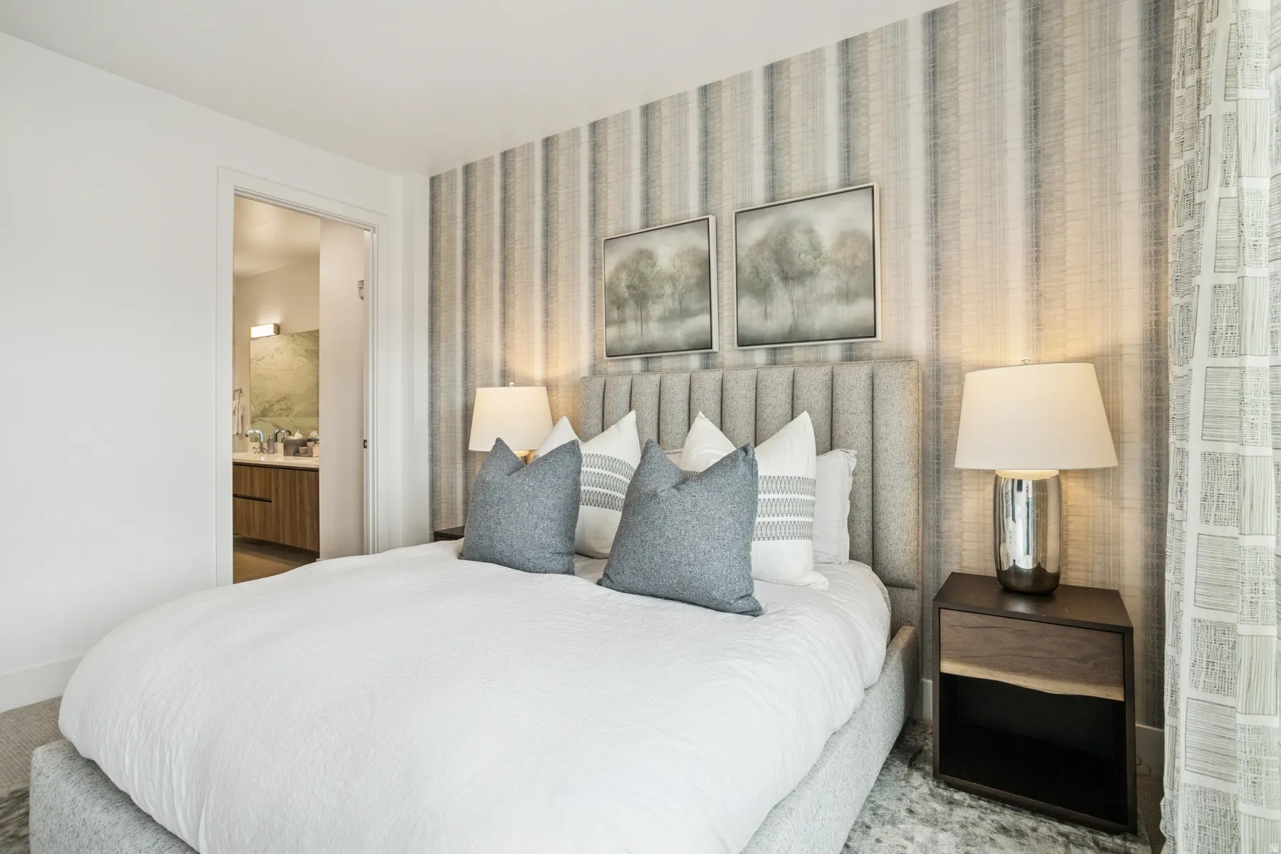 Bedroom with wallpapered walls and ensuite bathroom