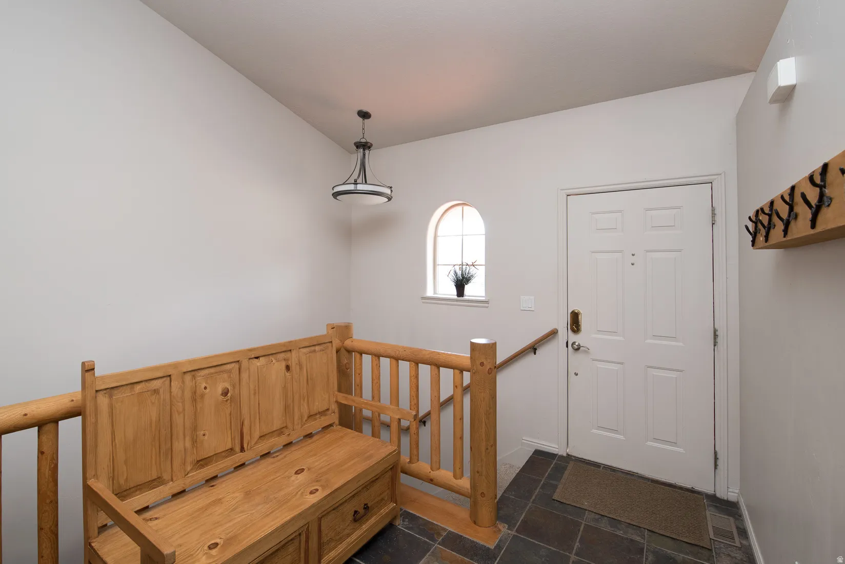 Entryway featuring stone tile floors