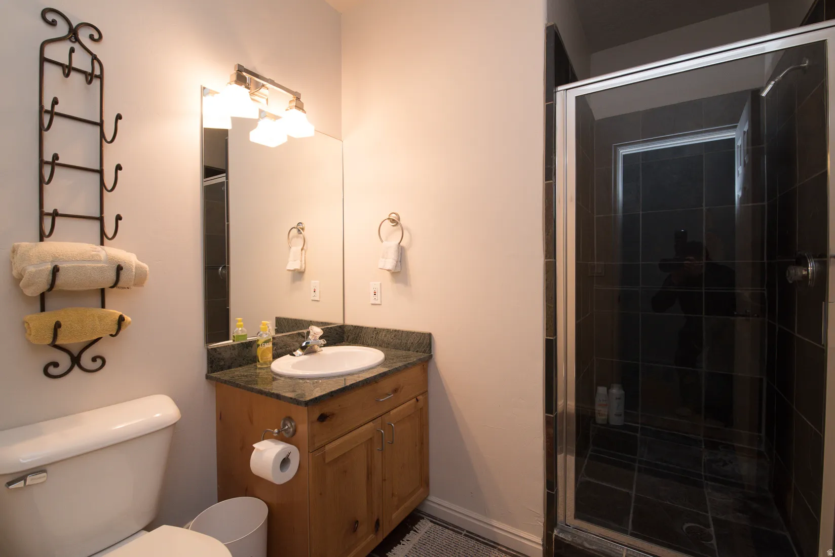Bathroom with vanity and a shower stall