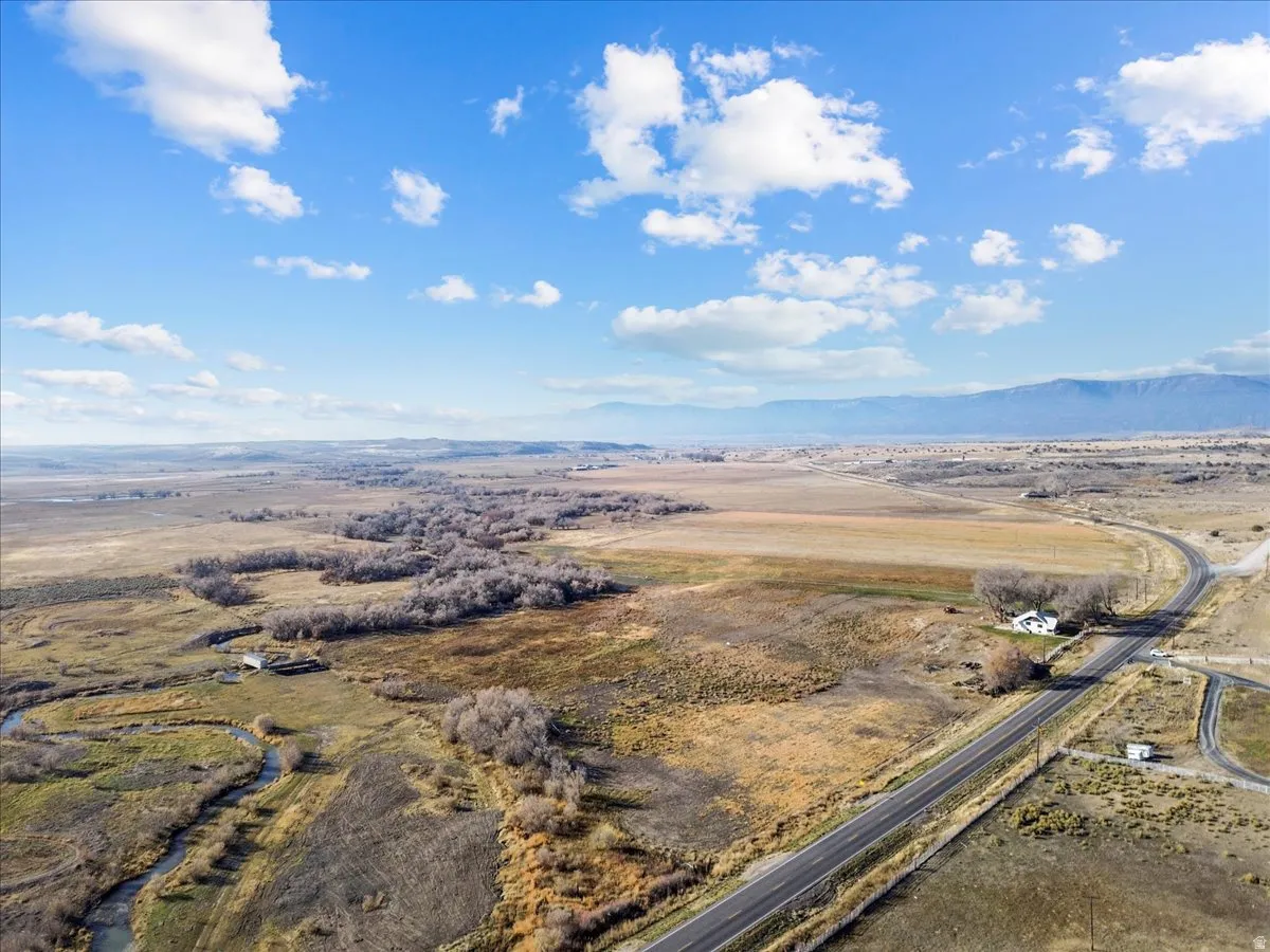 Overview of rural landscape with a mountain backdrop