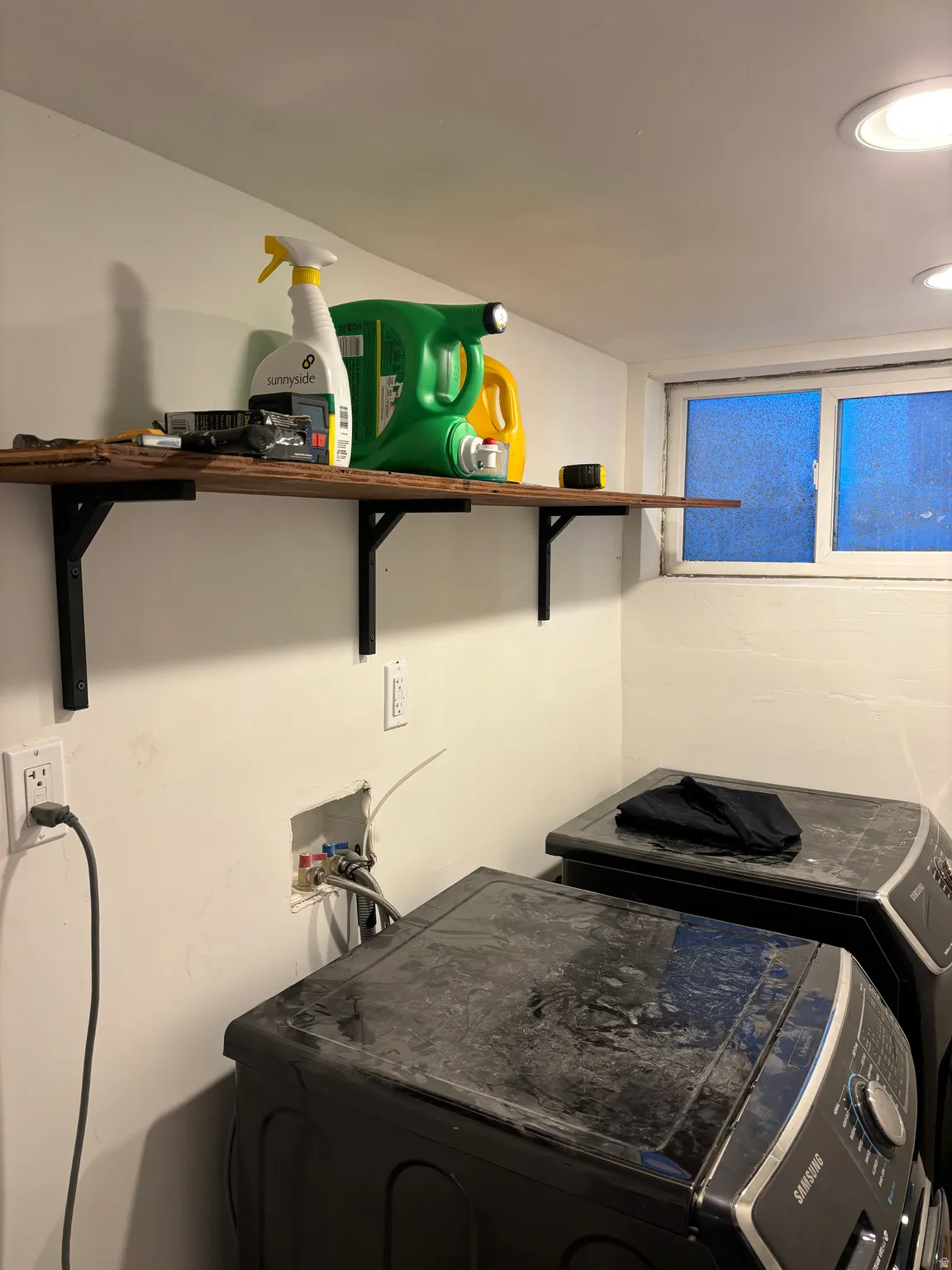 Laundry area with washing machine and clothes dryer