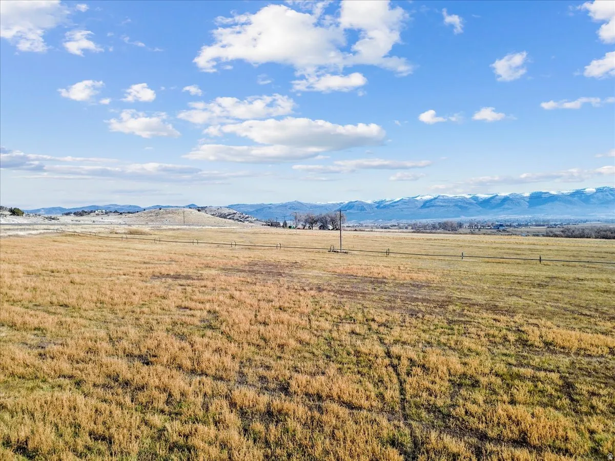 View of mountain background featuring rural landscape