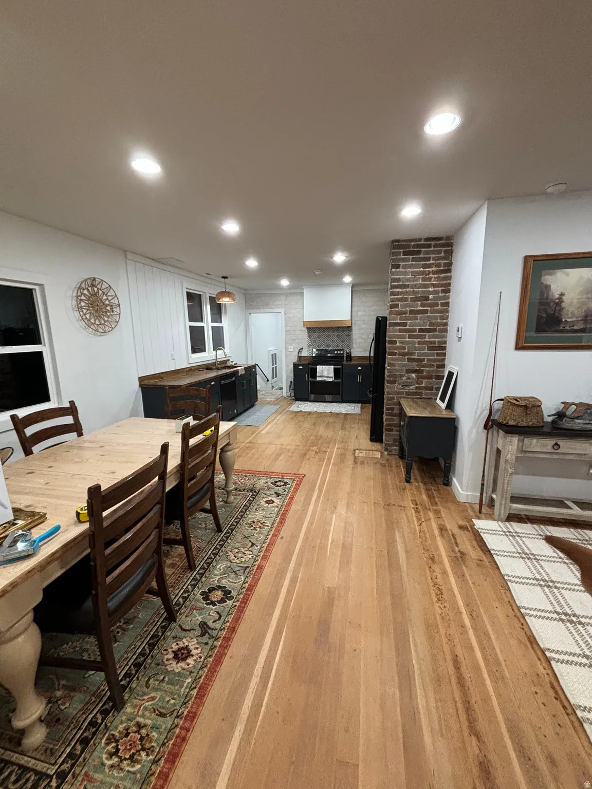 Dining space featuring light wood-type flooring and recessed lighting