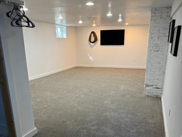 Basement featuring carpet and recessed lighting