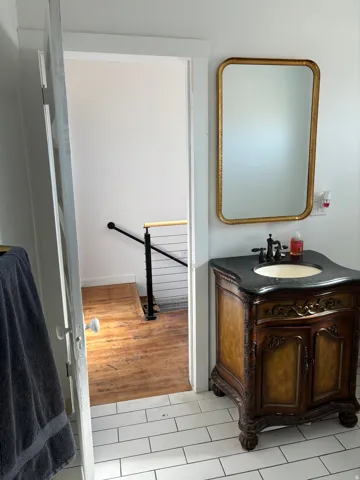 Bathroom with vanity and light tile patterned floors