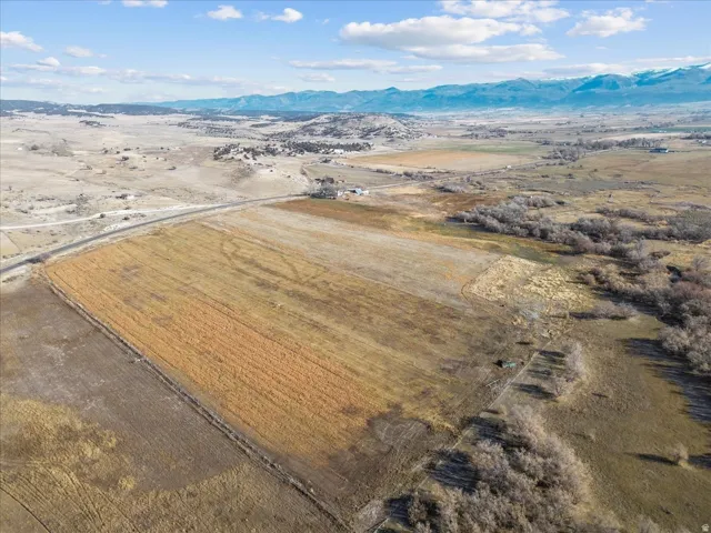 Aerial view of sparsely populated area featuring a mountain backdrop