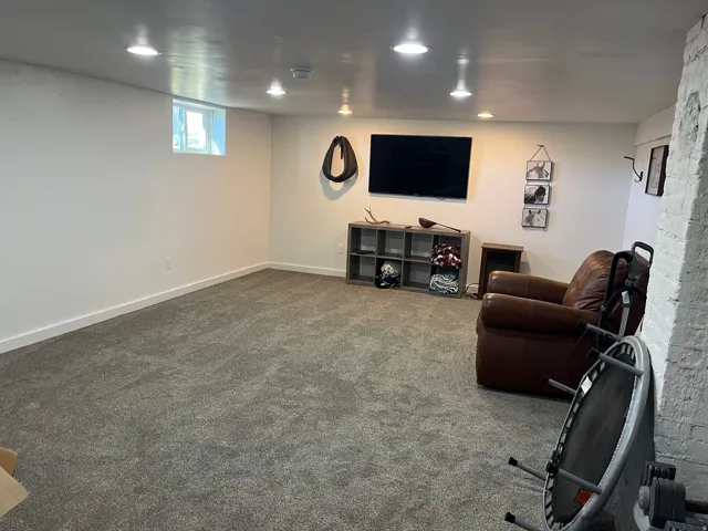 Workout room with carpet and recessed lighting