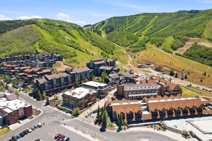Expansive mountain landscape featuring lush green slopes