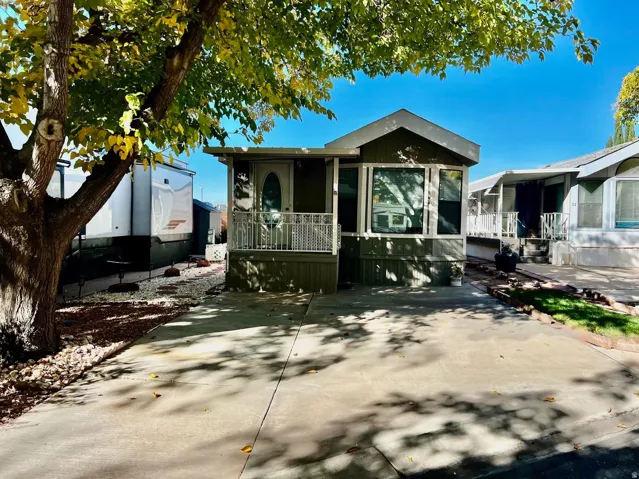 View of front of property with a sunroom