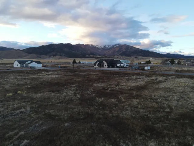 View of mountain background featuring rural landscape