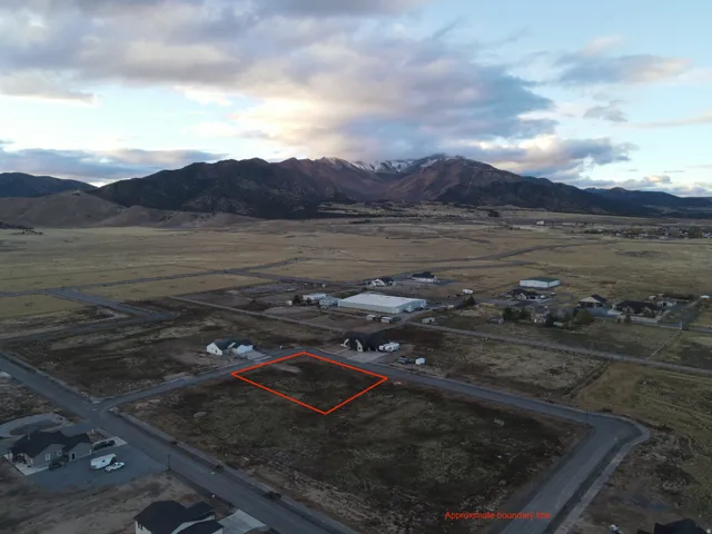 View of rural area with property parcel outlined and a mountainous background