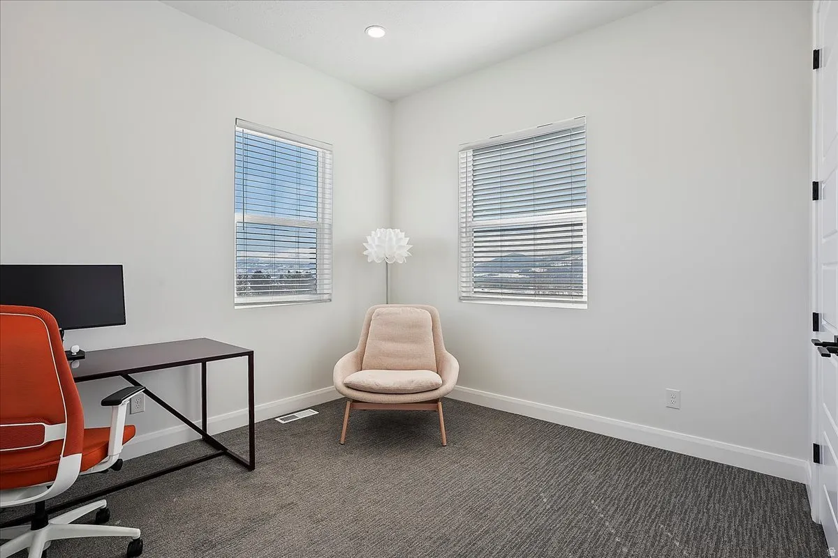 Office space featuring carpet flooring and recessed lighting