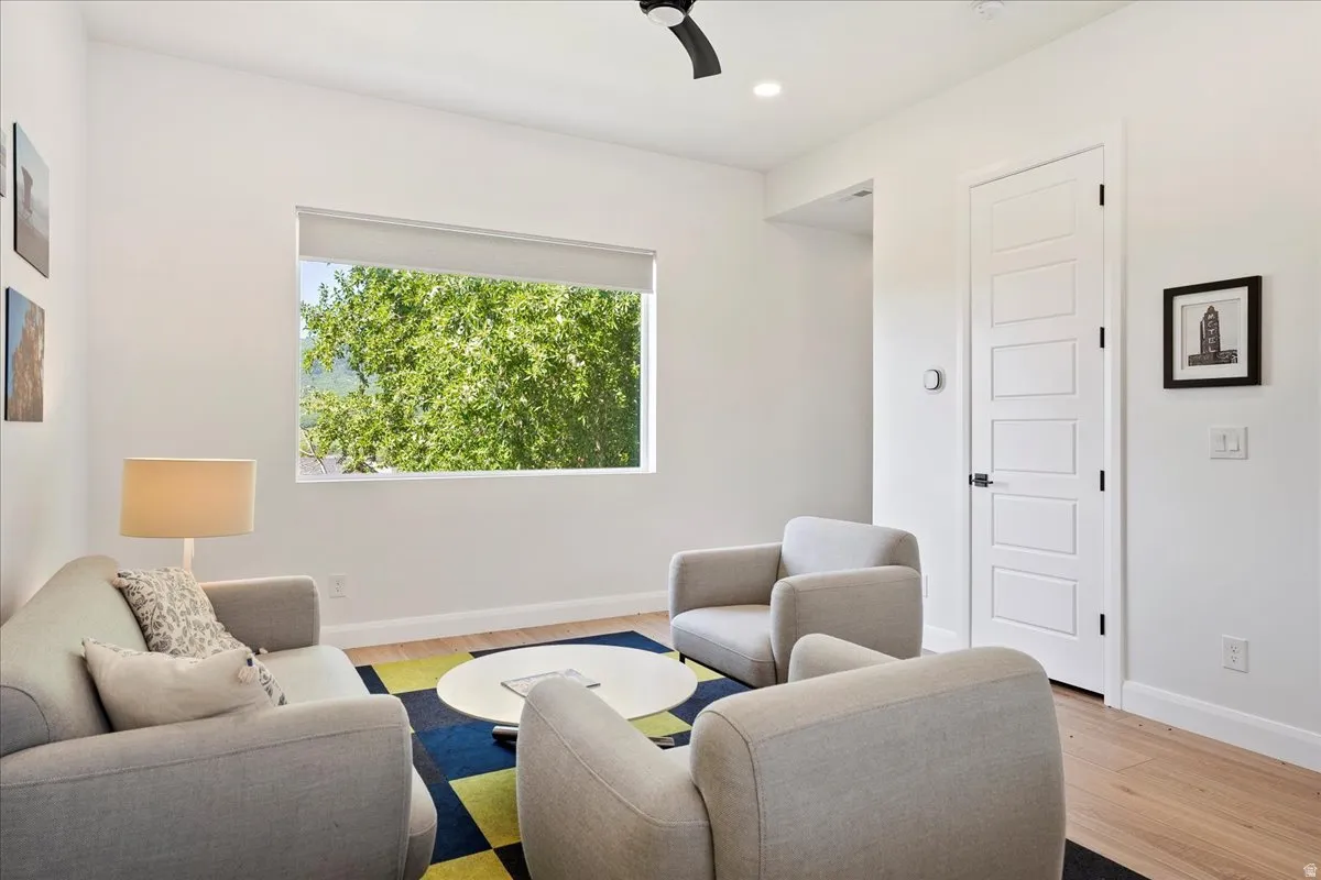 Sitting room featuring light wood-style floors and recessed lighting