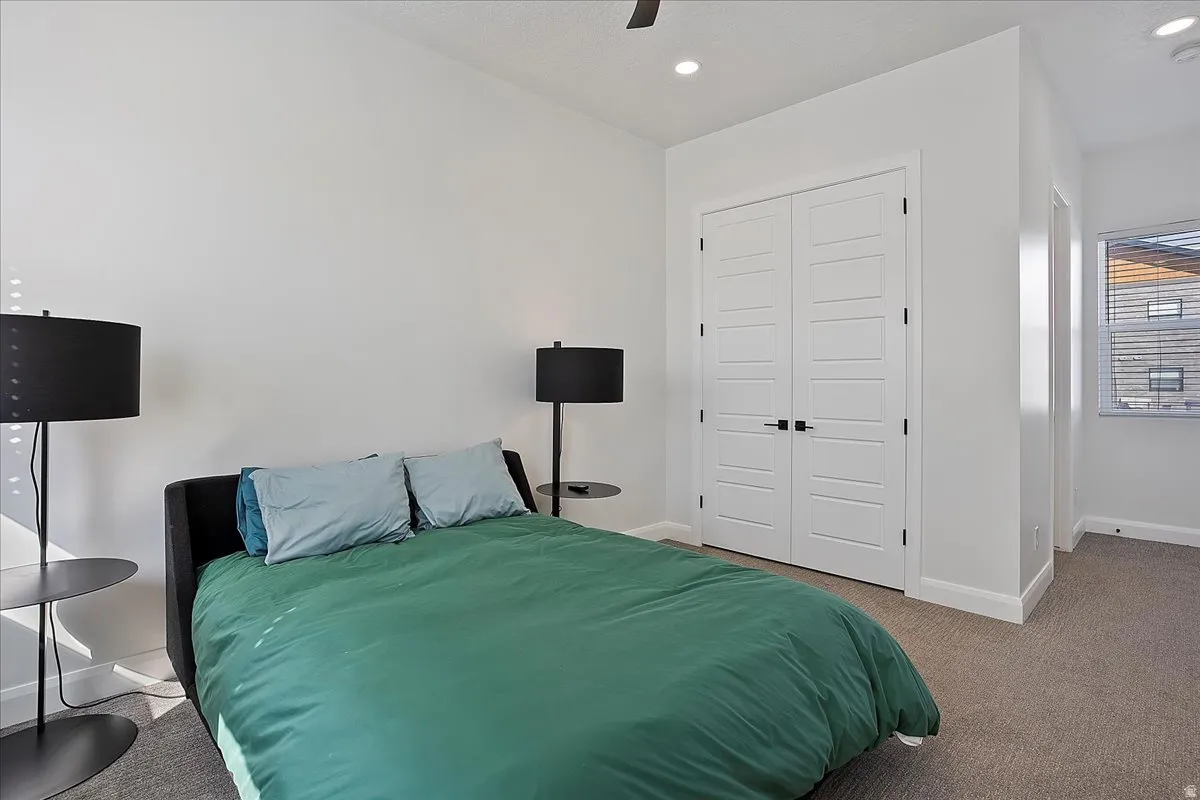 Bedroom featuring carpet flooring, a closet, recessed lighting, and a ceiling fan