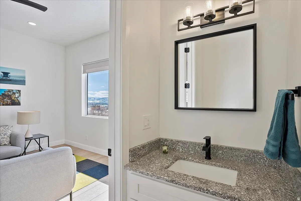 Bathroom with vanity, light wood-style floors, and recessed lighting