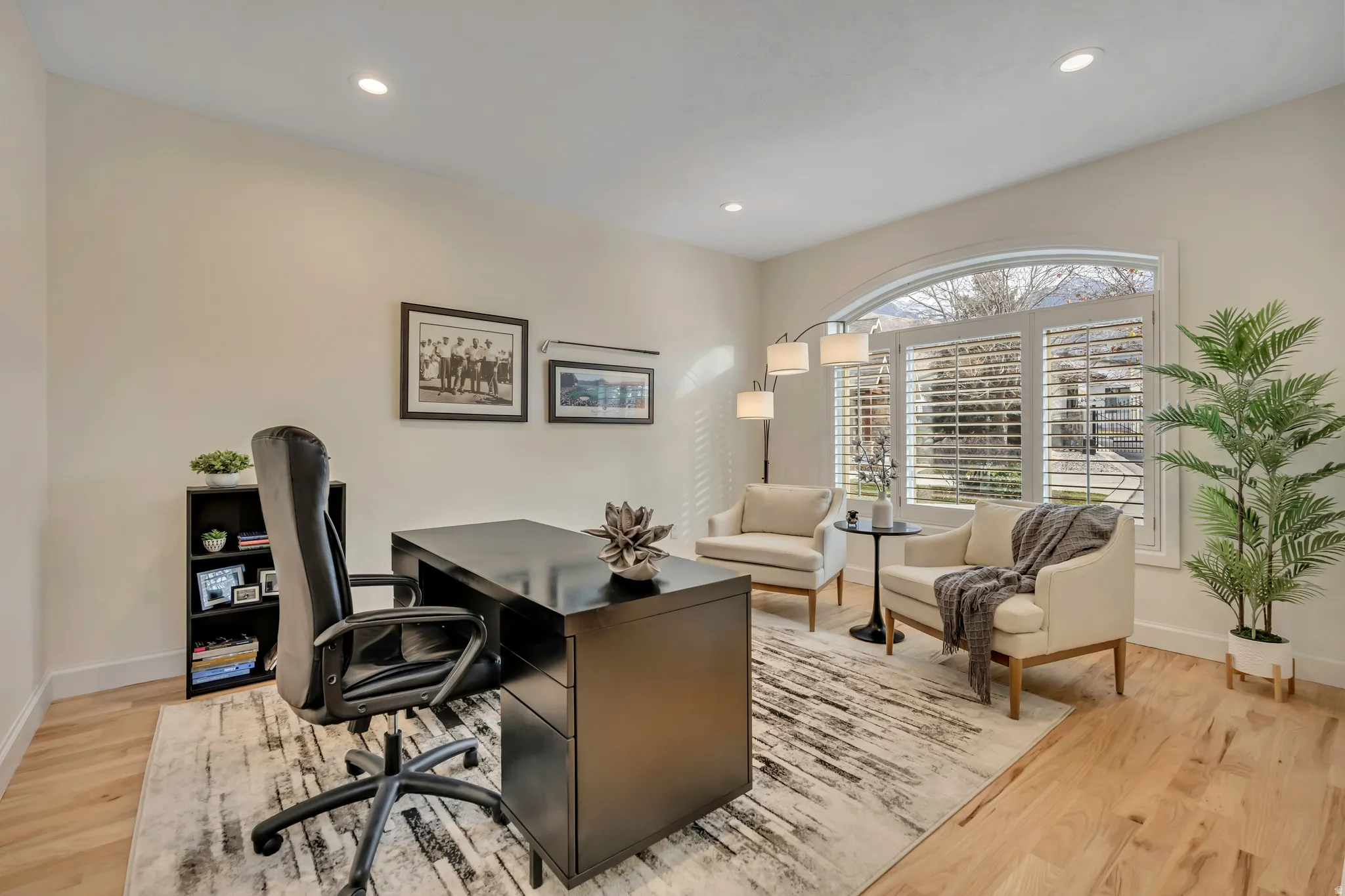 Office area with recessed lighting and light wood-style floors