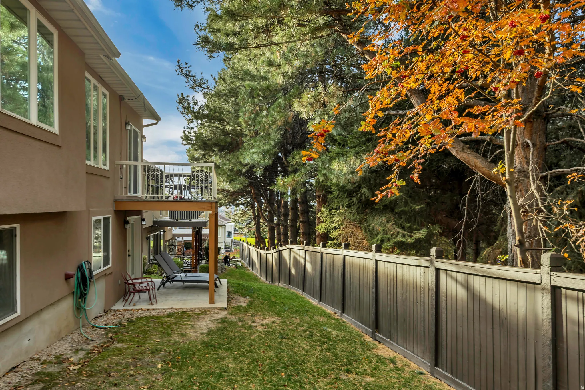 Fenced backyard with a patio area