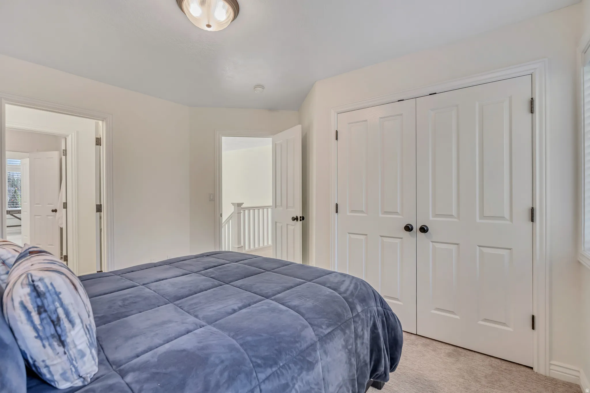 Second Level secondary bedroom featuring carpet floors and a closet