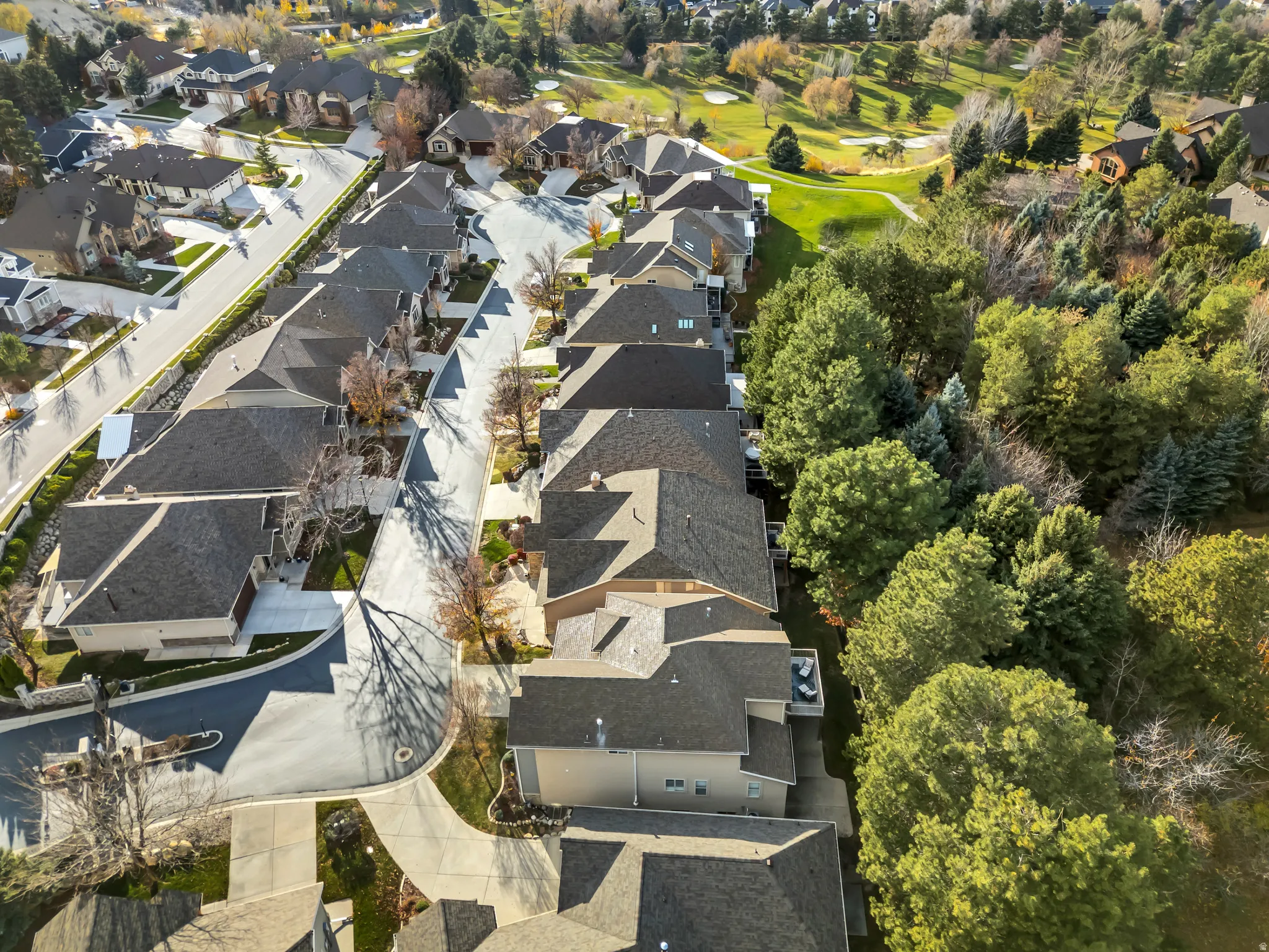 Aerial view of property's location featuring nearby suburban area