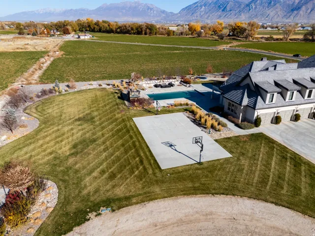 Overview of rural landscape featuring mountains and a pool area