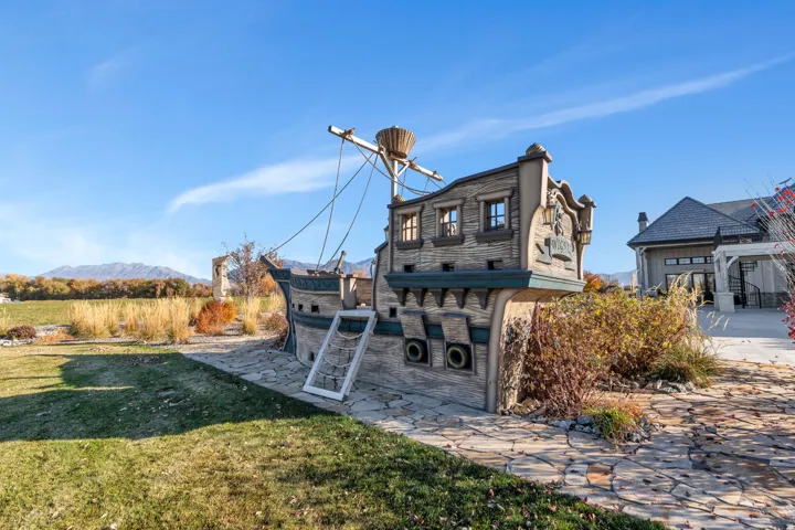 Rear view of property featuring a yard