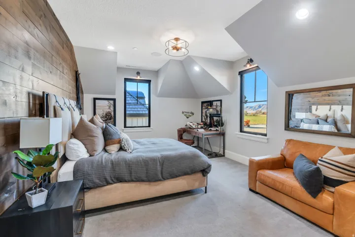 Carpeted bedroom with recessed lighting, wooden walls, and vaulted ceiling