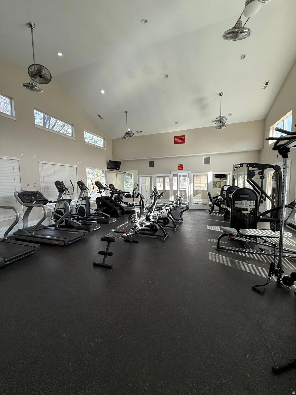 Exercise room featuring lofted ceiling and recessed lighting