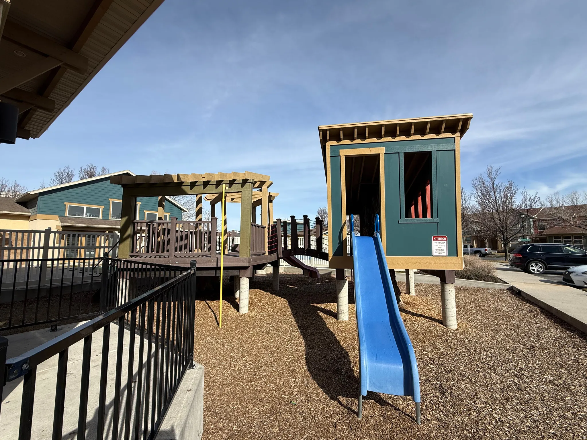 View of playground featuring a pergola